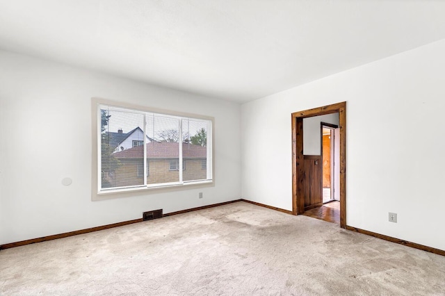 2301 W High St, Racine, WI 53404 - unfurnished room with carpet flooring and baseboards