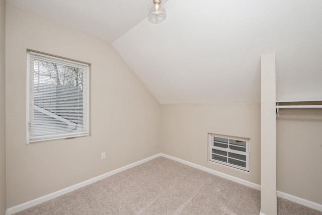 301 Maple Ave, Clinton, WI 53525 - additional living space featuring lofted ceiling, carpet floors, and baseboards