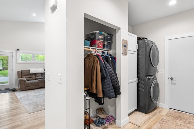 420 Sandmar Dr, Ripon, WI 54971 - washroom with estacked washer and dryer, light wood-style floors, recessed lighting, and baseboards