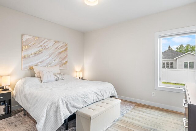 420 Sandmar Dr, Ripon, WI 54971 - bedroom with light wood finished floors and baseboards