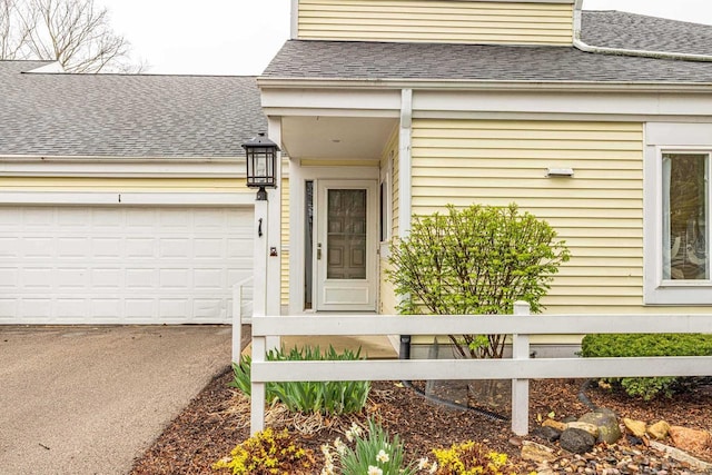 1 Winterberry Trl, Madison, WI 53717 - property entrance featuring roof with shingles, asphalt driveway, and an attached garage