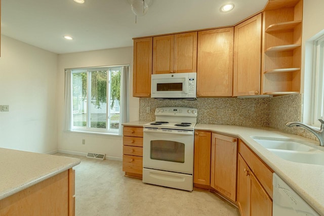1 Winterberry Trl, Madison, WI 53717 - kitchen featuring white appliances, a sink, light countertops, backsplash, and recessed lighting