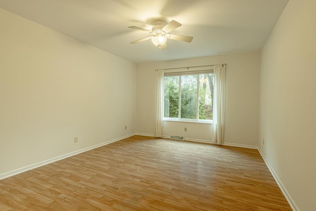 1 Winterberry Trl, Madison, WI 53717 - empty room with a ceiling fan, light wood-style floors, and baseboards
