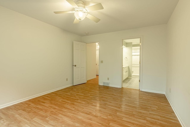 1 Winterberry Trl, Madison, WI 53717 - unfurnished bedroom with light wood-type flooring, baseboards, ensuite bathroom, and a ceiling fan