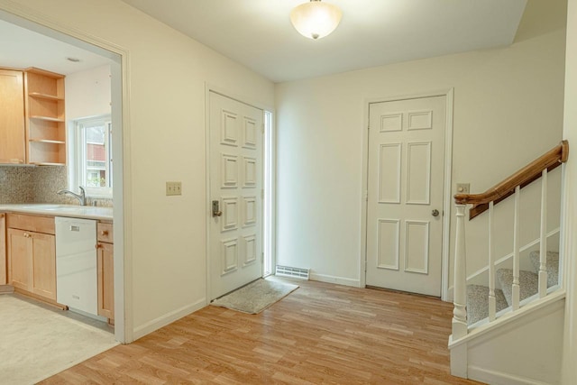 1 Winterberry Trl, Madison, WI 53717 - foyer entrance featuring stairway, light wood finished floors, and baseboards