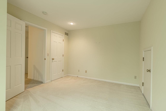 1 Winterberry Trl, Madison, WI 53717 - unfurnished bedroom with light colored carpet, baseboards, and recessed lighting