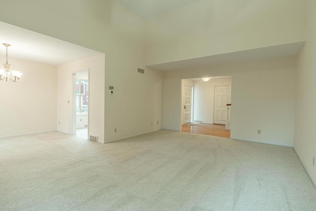 1 Winterberry Trl, Madison, WI 53717 - unfurnished room featuring a chandelier, light colored carpet, and baseboards