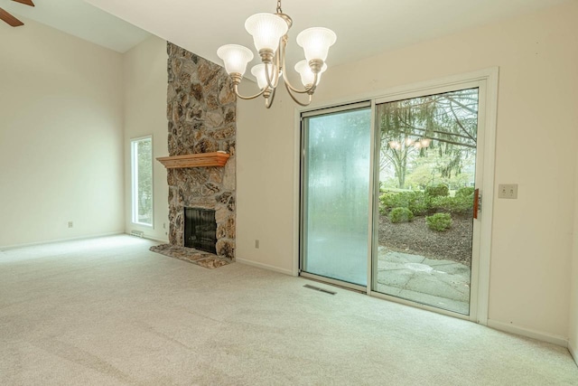 1 Winterberry Trl, Madison, WI 53717 - unfurnished living room featuring carpet flooring, a chandelier, baseboards, and a fireplace