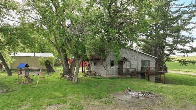 N10221 970th St, Colfax, WI 54730 - view of grassy yard featuring a deck and a playground