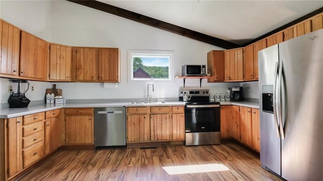 N10221 970th St, Colfax, WI 54730 - kitchen with stainless steel appliances, a sink, wood finished floors, and light countertops