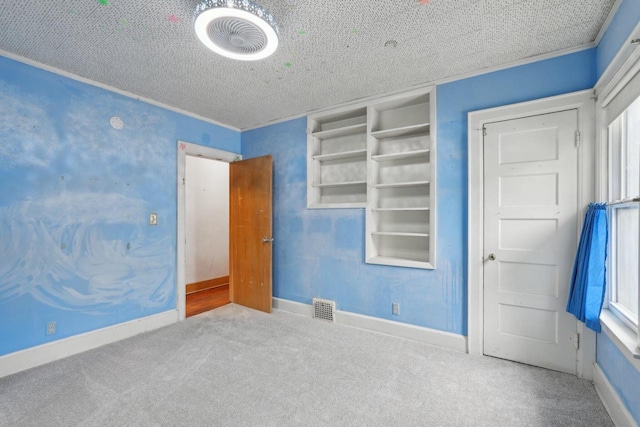 1525 N 69th St, Wauwatosa, WI 53213 - unfurnished bedroom with carpet floors and a textured ceiling