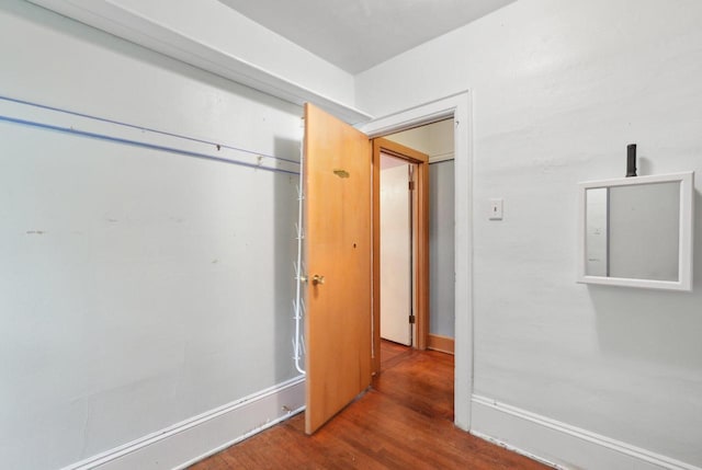 1525 N 69th St, Wauwatosa, WI 53213 - unfurnished bedroom featuring wood finished floors, a closet, and baseboards