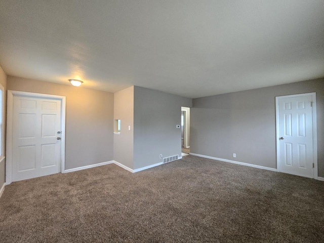 6229 W Keefe Avenue Parkway Unit 6229A, Milwaukee, WI 53216 - unfurnished room featuring baseboards and dark colored carpet