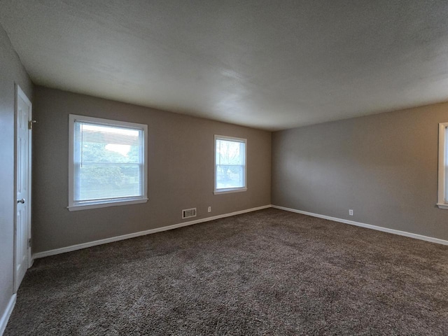 6229 W Keefe Avenue Parkway Unit 6229A, Milwaukee, WI 53216 - spare room featuring dark colored carpet and baseboards