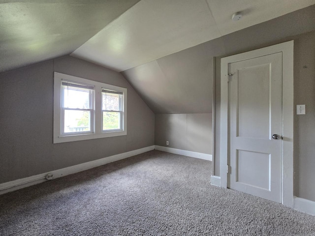 2931 N 58th St, Milwaukee, WI 53210 - additional living space featuring carpet floors, lofted ceiling, and baseboards