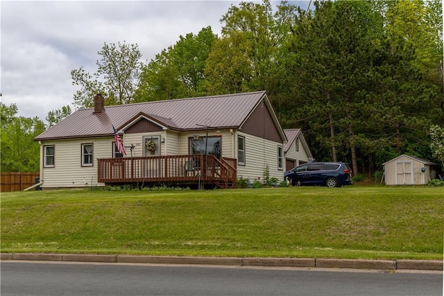1007 Menasha Ave, Ladysmith, WI 54848 - ranch-style home featuring a deck, a chimney, and metal roof