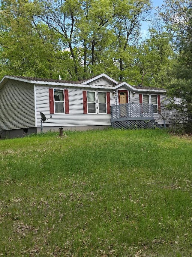 2942 Brentwood Dr, Grand Marsh, WI 53936 - manufactured / mobile home with a wooden deck and view of wooded area