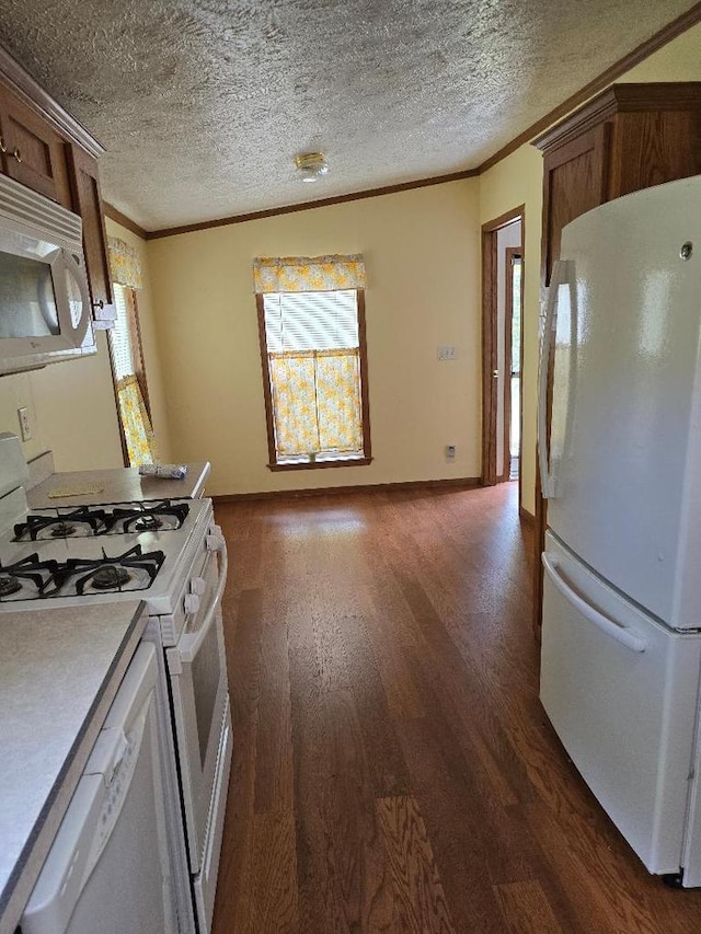 2942 Brentwood Dr, Grand Marsh, WI 53936 - kitchen featuring white appliances, crown molding, dark wood-type flooring, a textured ceiling, and light countertops