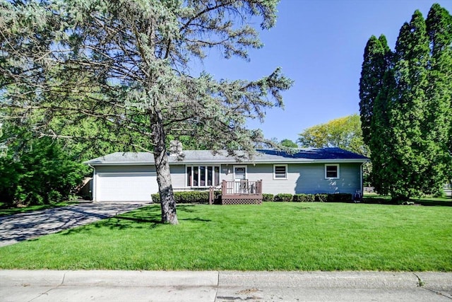 1610 Woodsend Ct, Sun Prairie, WI 53590 - single story home with a garage, concrete driveway, a front yard, and a wooden deck