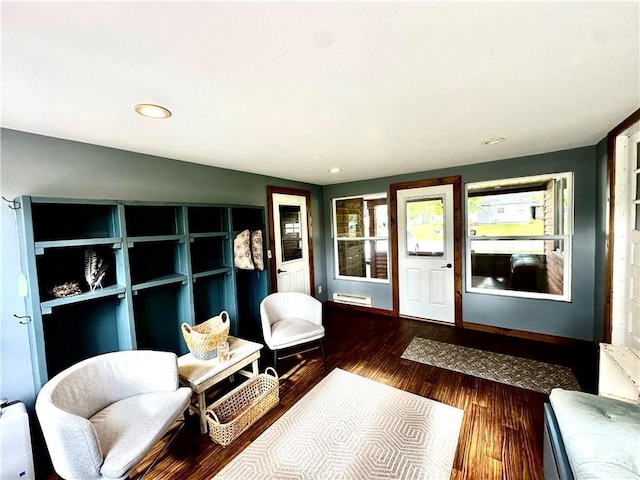 1019 2nd St, Bruce, WI 54819 - sitting room with wood finished floors, recessed lighting, and a baseboard heating unit