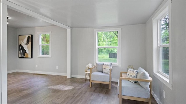 2572 90th St, Eau Claire, WI 54703 - sitting room featuring plenty of natural light, wood finished floors, and baseboards