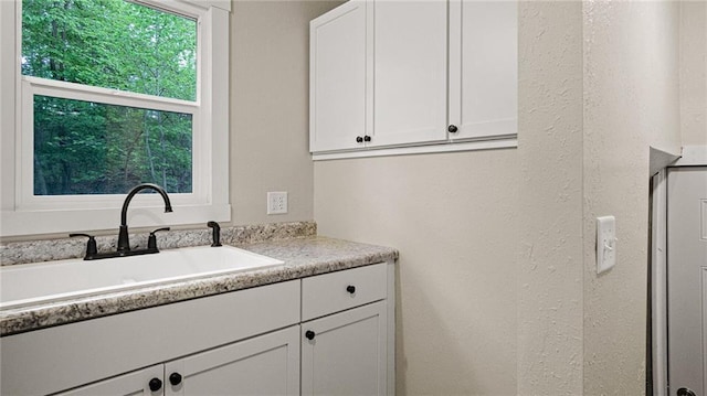 2572 90th St, Eau Claire, WI 54703 - laundry room with a sink and a textured wall
