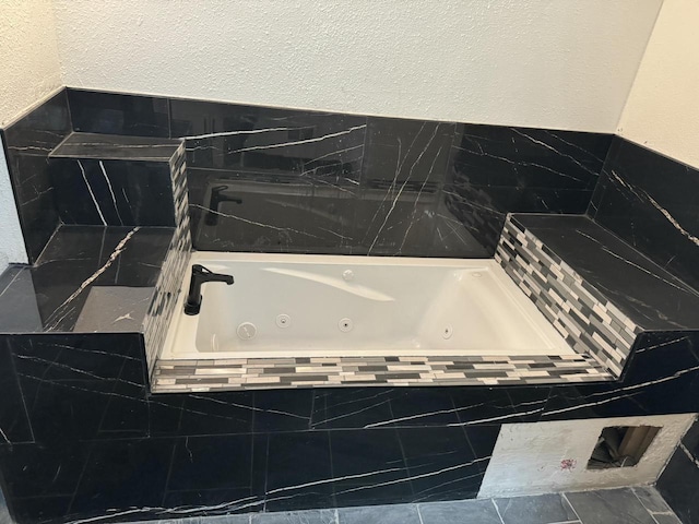 3124 N Buffum St, Milwaukee, WI 53212 - full bathroom featuring a whirlpool tub and a textured wall