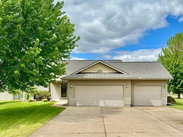11684 44th Ave, Chippewa Falls, WI 54729 - multi unit property featuring concrete driveway, a front yard, a shingled roof, and a garage