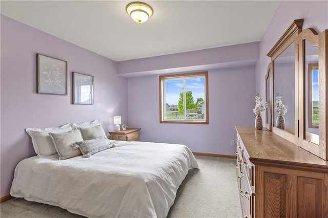 11684 44th Ave, Chippewa Falls, WI 54729 - bedroom featuring light colored carpet, multiple windows, and baseboards