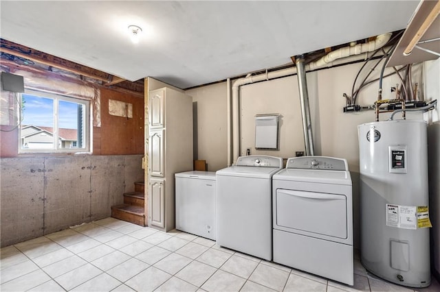 11684 44th Ave, Chippewa Falls, WI 54729 - laundry area with electric water heater, washer and clothes dryer, cabinet space, and light tile patterned floors