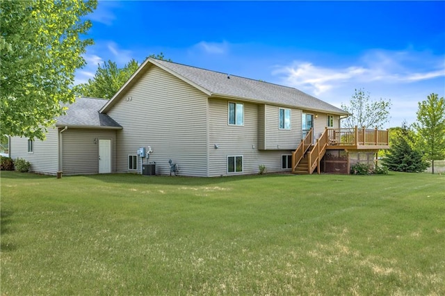 11684 44th Ave, Chippewa Falls, WI 54729 - back of property with stairs, a wooden deck, a lawn, and cooling unit