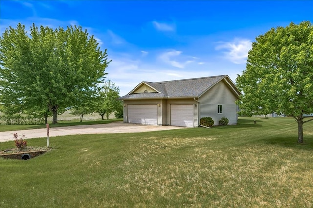 11684 44th Ave, Chippewa Falls, WI 54729 - view of side of property with a lawn, a garage, and driveway