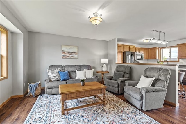11684 44th Ave, Chippewa Falls, WI 54729 - living area featuring dark wood-type flooring and baseboards
