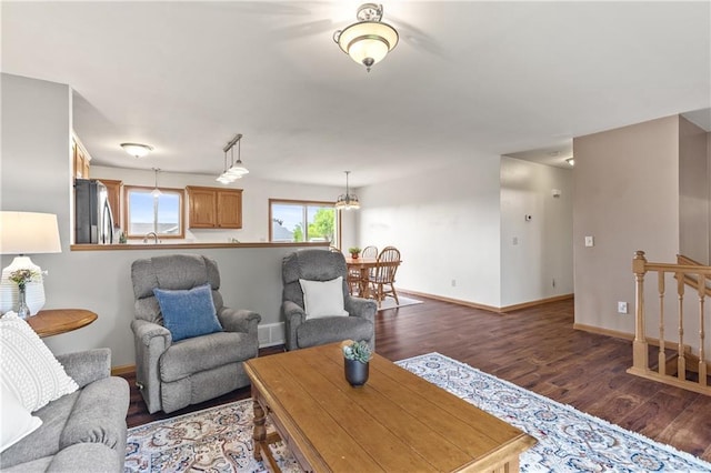 11684 44th Ave, Chippewa Falls, WI 54729 - living room featuring dark wood-style flooring and baseboards