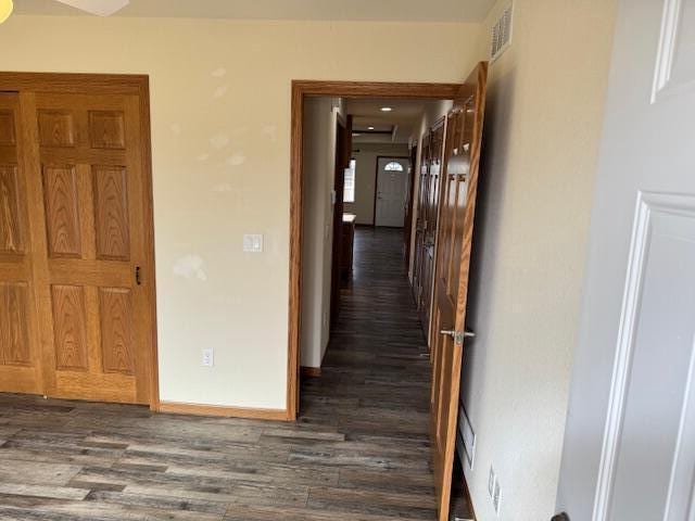 1329 S Wilson Ave, Hartford, WI 53027 - hall with dark wood-type flooring and baseboards