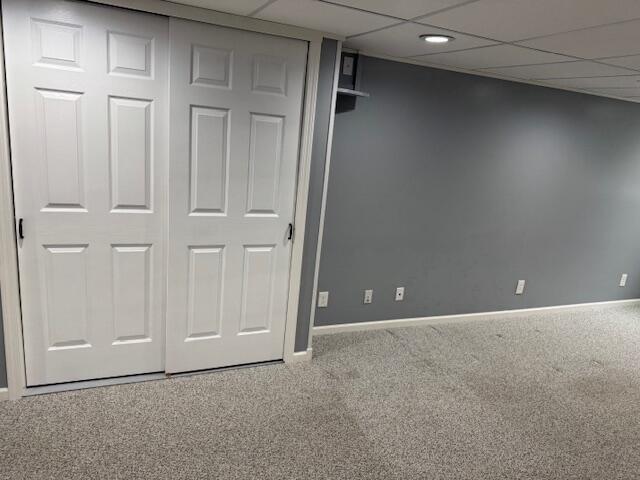 1329 S Wilson Ave, Hartford, WI 53027 - unfurnished bedroom featuring carpet floors, baseboards, a paneled ceiling, and a closet