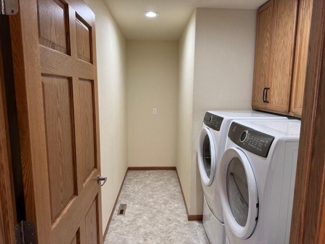 1329 S Wilson Ave, Hartford, WI 53027 - laundry area featuring washing machine and dryer, baseboards, recessed lighting, and cabinet space