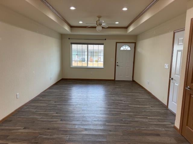1329 S Wilson Ave, Hartford, WI 53027 - entryway featuring a tray ceiling, ceiling fan, ornamental molding, dark wood-style floors, and recessed lighting