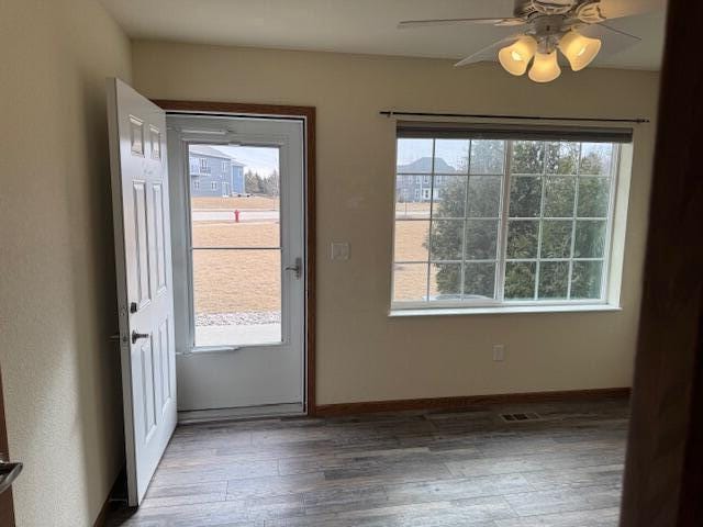1329 S Wilson Ave, Hartford, WI 53027 - entryway with ceiling fan, wood finished floors, and baseboards