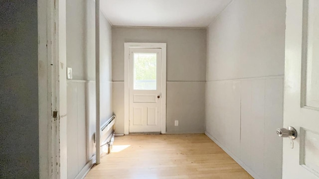 5410 N 37th St, Milwaukee, WI 53209 - doorway with light wood finished floors and a wainscoted wall
