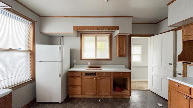 5410 N 37th St, Milwaukee, WI 53209 - kitchen with freestanding refrigerator, open shelves, ornamental molding, brown cabinetry, and light countertops