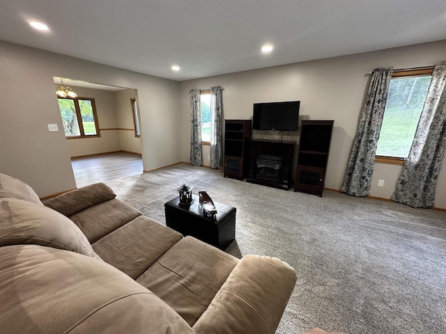 N2224 Wafle Rd, Mauston, WI 53948 - living area featuring healthy amount of natural light, carpet floors, recessed lighting, baseboards, and a chandelier