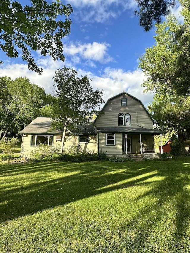 N2224 Wafle Rd, Mauston, WI 53948 - view of front of home with a gambrel roof and a front yard