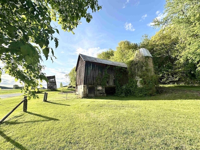 N2224 Wafle Rd, Mauston, WI 53948 - view of grassy yard with an outdoor structure and a barn