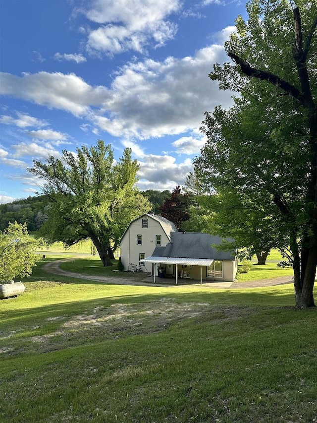 N2224 Wafle Rd, Mauston, WI 53948 - view of grassy yard featuring an attached carport and driveway