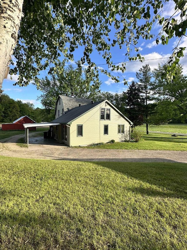 N2224 Wafle Rd, Mauston, WI 53948 - view of side of home with a lawn and driveway