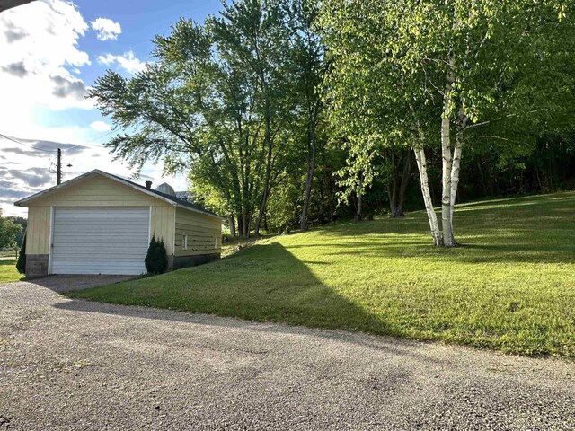 N2224 Wafle Rd, Mauston, WI 53948 - view of grassy yard with a detached garage and gravel driveway