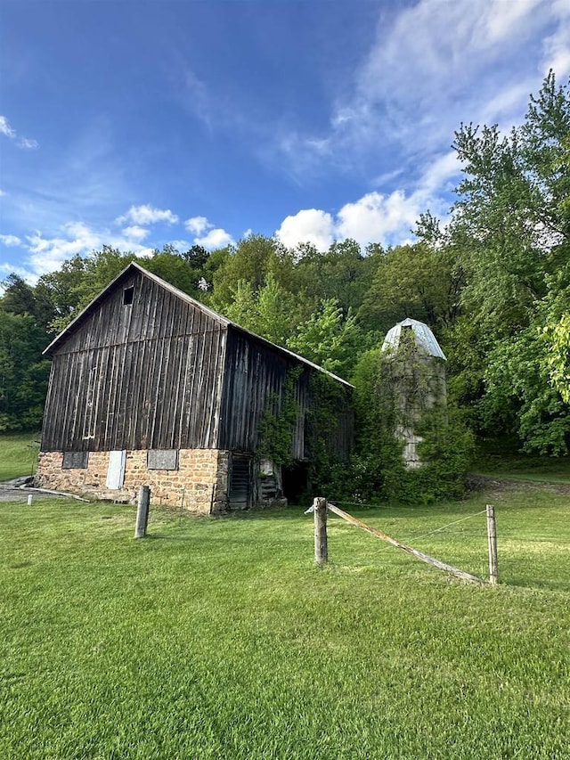 N2224 Wafle Rd, Mauston, WI 53948 - view of outbuilding featuring a forest view