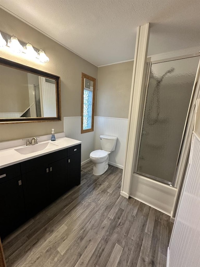 N2224 Wafle Rd, Mauston, WI 53948 - full bathroom featuring toilet, wood finished floors, wainscoting, a textured ceiling, and vanity