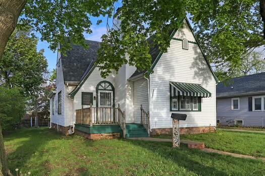 1107 Perry Ave, Racine, WI 53406 - back of house featuring a lawn
